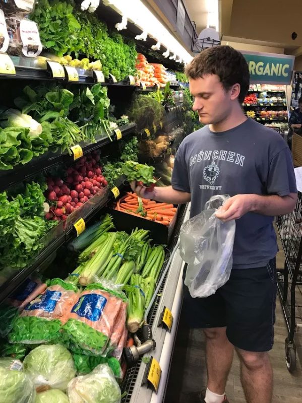 Jacob Exploring the Vegetables at the Grocery Store