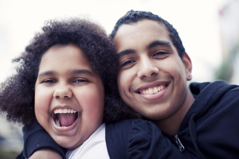 African american siblings having fun