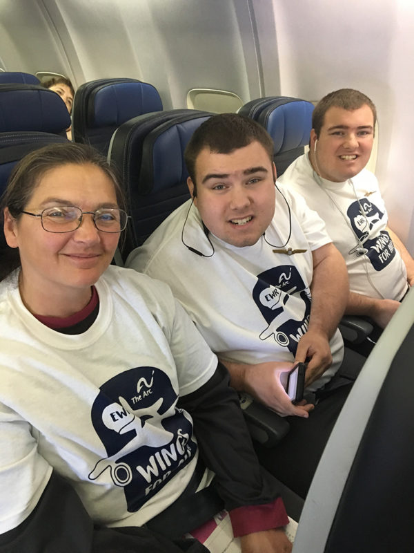 Joanne Furstman with twins Teddy and Nicky settled into their seats