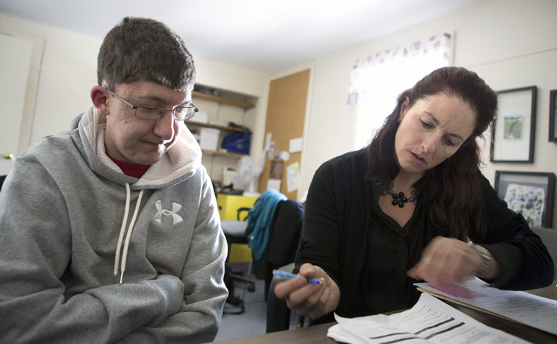 Alumni Center Director, Krista DiGregorio, helping Jake Hemmers with a job application (Photo courtesy of Lesley University) 