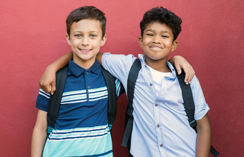 Smiling children friends embracing