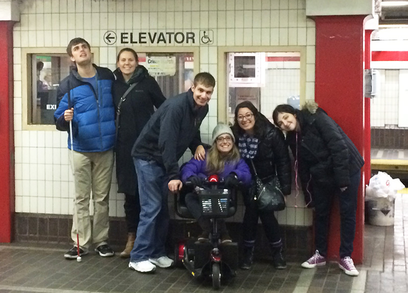Threshold students and alumni regularly travel on public transportation to activities and events. Staff utilize these trips as opportunities to offer travel training. Here they pose at Park Street MBTA station in Boston.
