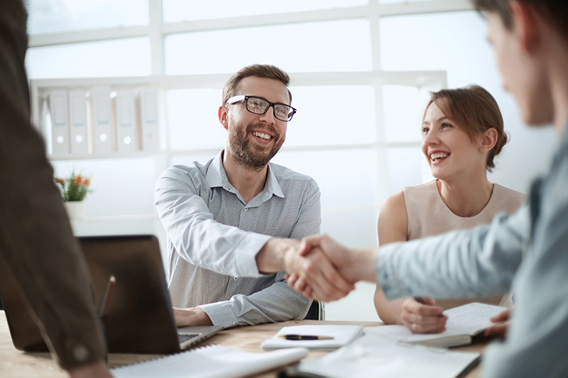 business man shaking hands with his supportive colleague