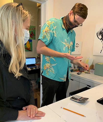 Eugene at a Vista’s retail store, Creations, practicing handling money during a job assessment to evaluate his vocational skills