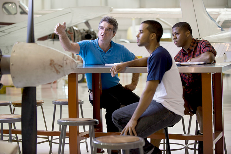 Students learning in Vaughn College's hanger