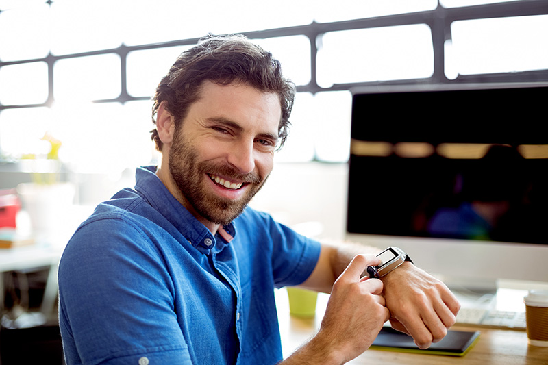 Man adjusting a smartwatch