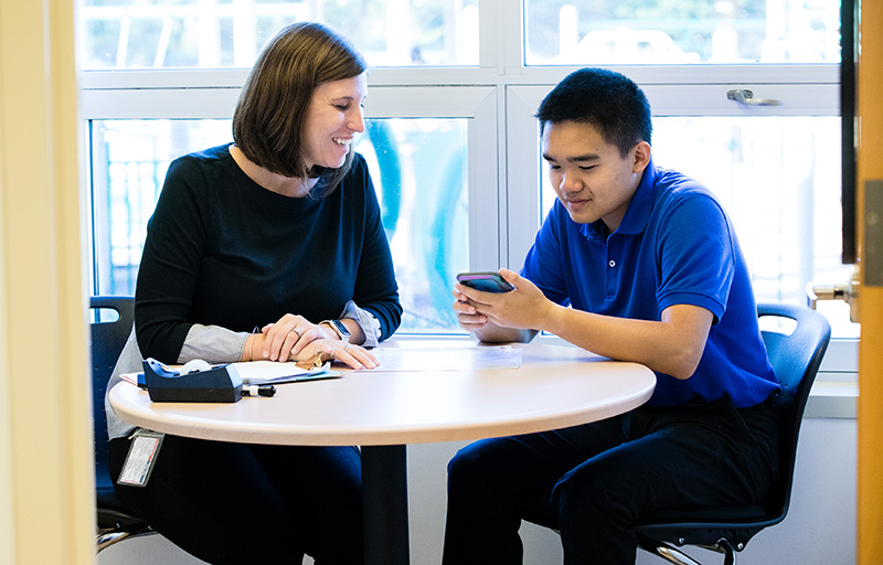 An Ivymount student practices sharing his This is Me (TiME) story with his speech-language therapist (and original developer of TiME stories), Danielle Pouliot Evans