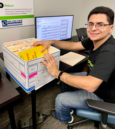 Jose Roman, co-author and Scan It Forward employee, is excited to highlight his new role and demonstrate successful employment when receiving the right accommodations and supports